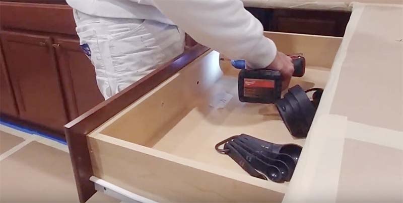 Removable drawer front being disassembled before cabinet spraying, Austin TX project