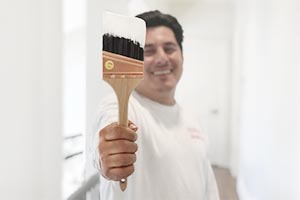 home-painter-paper-moon-painting-san-antonio-holding-brush