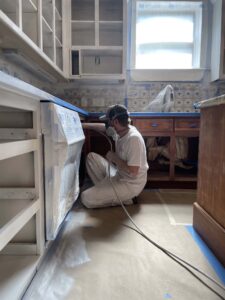 austin-cabinet-painter-priming-cabinets-paper-moon-painting