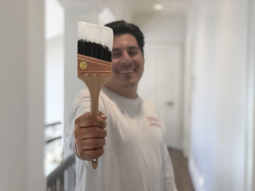 house-painter-with-white-paint-on-brush-scaled