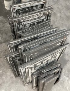 painting-cabinets-showing-grain-filler-on-grey-cabinet-doors