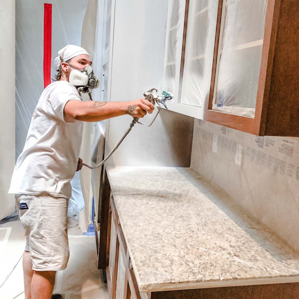 painting-cabinets-spraying-with-primer-pro-painter-austin-tx