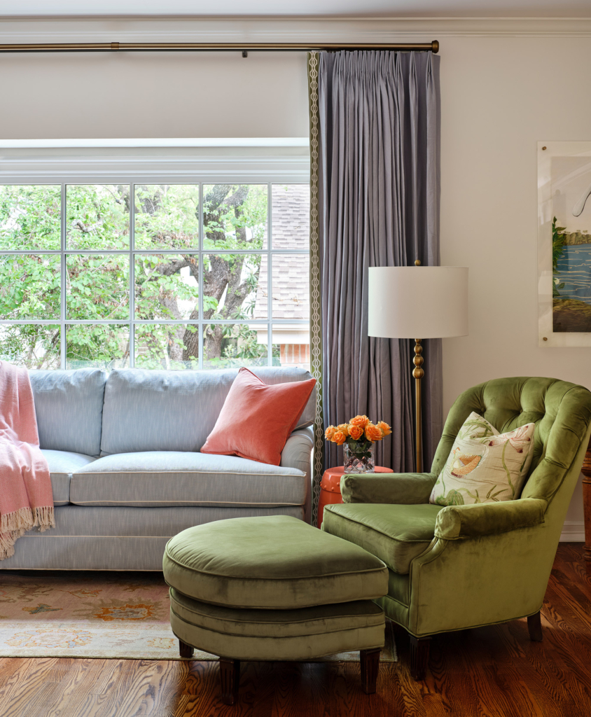 Blues, greens, and corals bring life to this sitting room area in the primary bedroom.