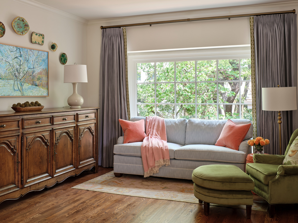 The primary bedroom spaciousness allowed designer Maria Beck to carve out a separate sitting area for relaxing and reading.