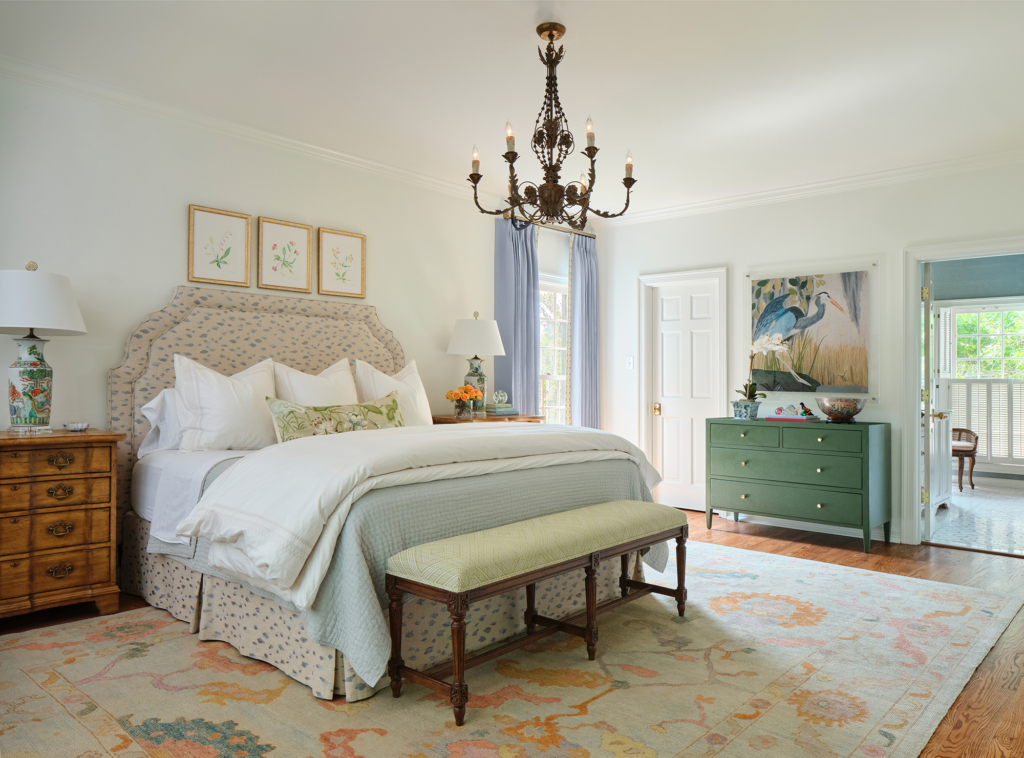 Light tones keep the primary bedroom feeling spacious and open.