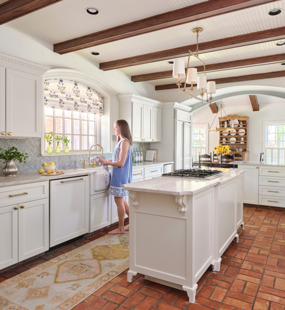 This spacious kitchen with breadboard ceiling was painted in a Farrow and Ball white.