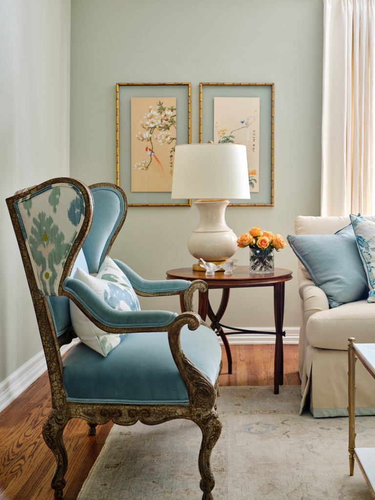 Pale blue tones anchor this elegant living room.
