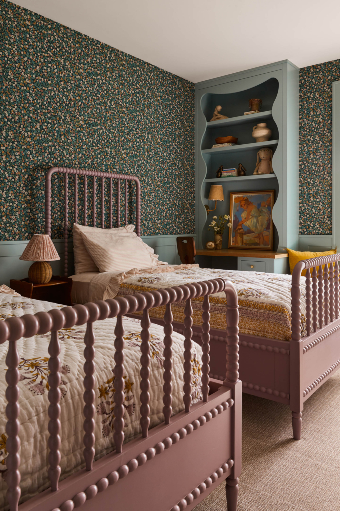 Guest room "Liberty of London" wallpaper with painted bookshelves and woodwork in Farrow & Ball "Dix Blue".