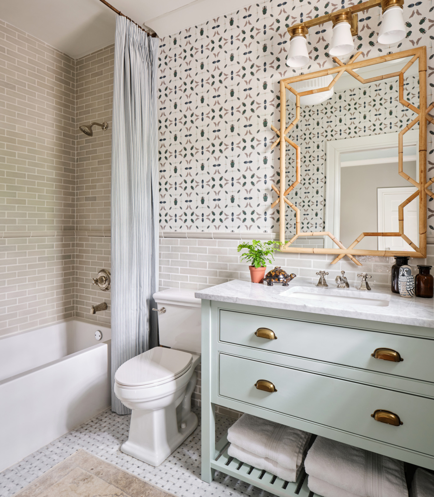 Beetle wallcovering and a green vanity bring playful charm to this boys’ bath. 