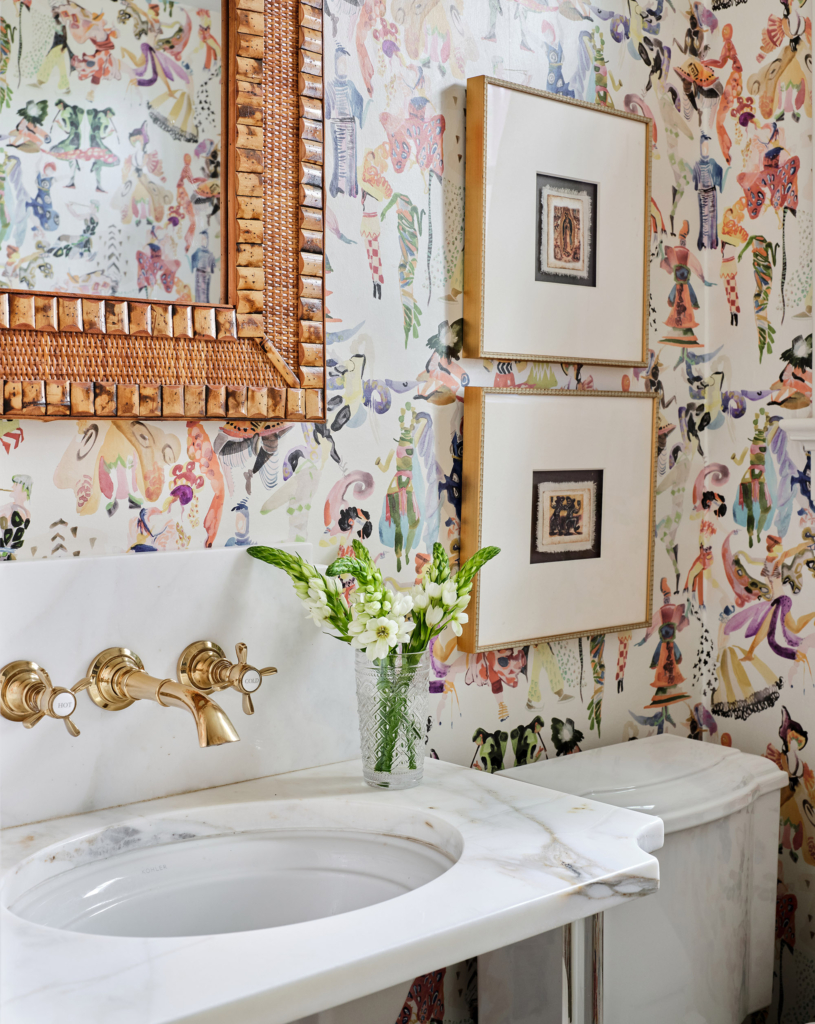 This fun, colorful wallpaper by Voutsa keeps the powder bath from every feeling boring.