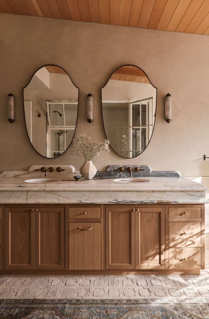 Serene primary bath with beautifully textured lime-painted walls for a soft, natural finish.