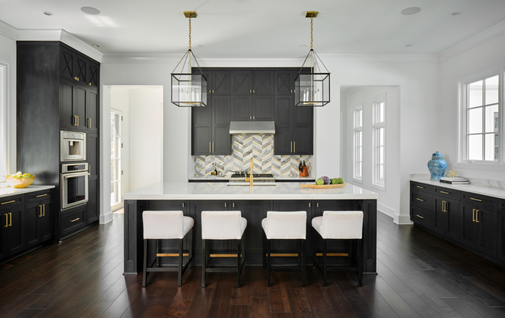 A contemporary kitchen, with cabinets painted in Benjamin Moore "Midnight Oil", and then given a custom cerused finish by our expert cabinet painters.
