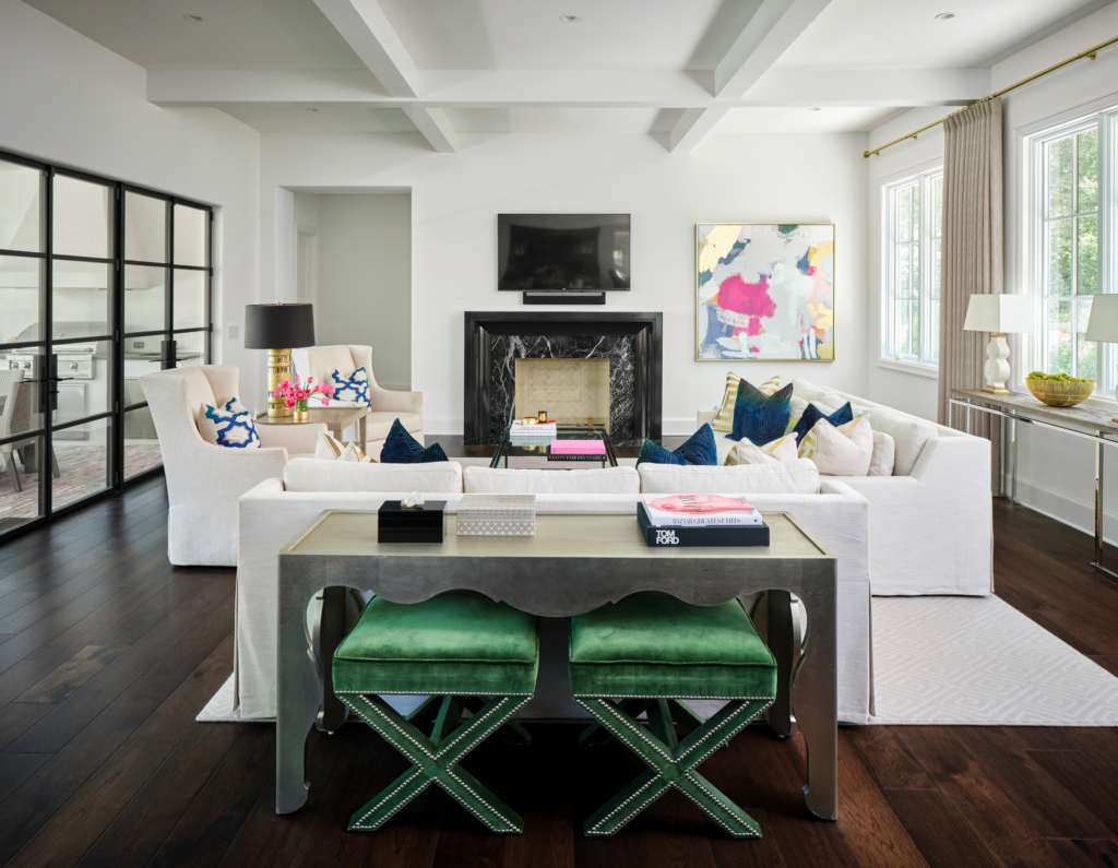 Crisp contrast and timeless style. This Alamo Heights living room features walls in Sherwin Williams "Pure White" paired with a bold fireplace mantel in Sherwin William "Tricorn Black". A clean, modern look.
