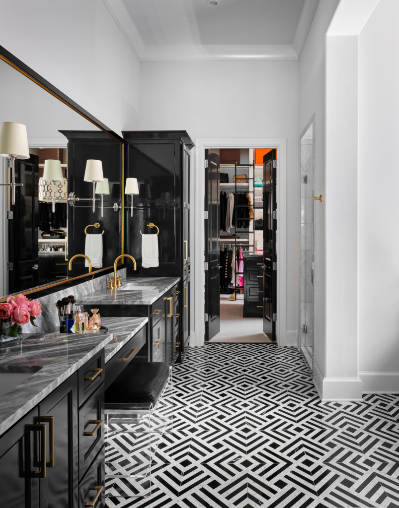 Luxury in every detail. This primary bathroom features cabinets painted in Sherwin Williams "Tricorn Black" with a high-gloss finish, adding depth, drama, and sophistication.