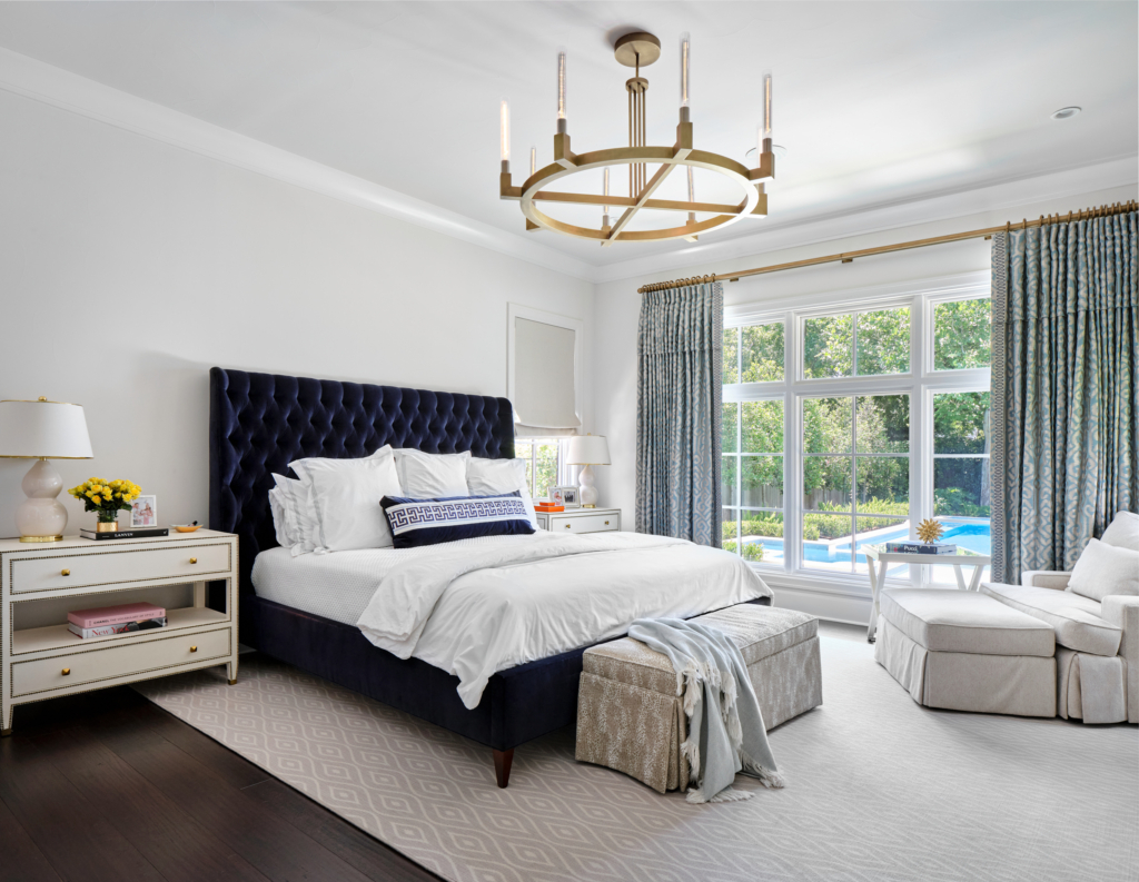 A peaceful primary bedroom in Sherwin Williams "Pure White", painted with care by Paper Moon Painting in Alamo Heights, TX.