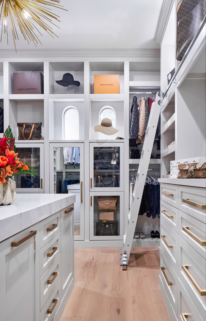 Spacious closet in the master bedroom has features like a library ladder for ease of access.