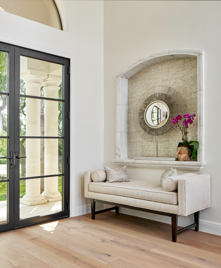 Striking entry foyer with a modern steel front door.