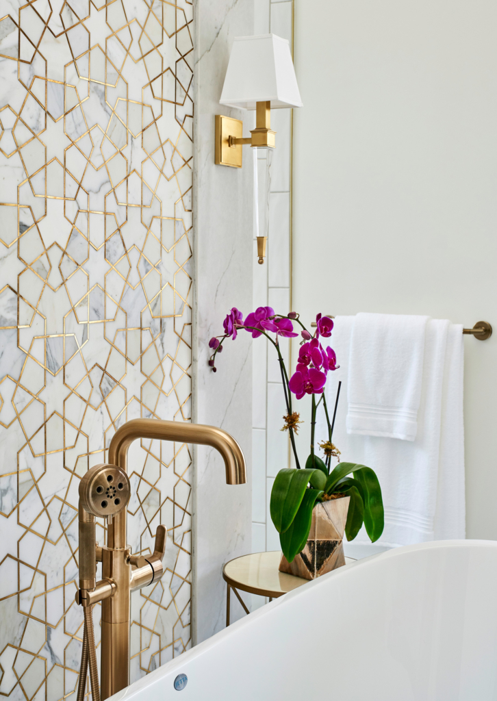 Brass hardware and detailed insets in the mosaic tile are such beautiful touches.