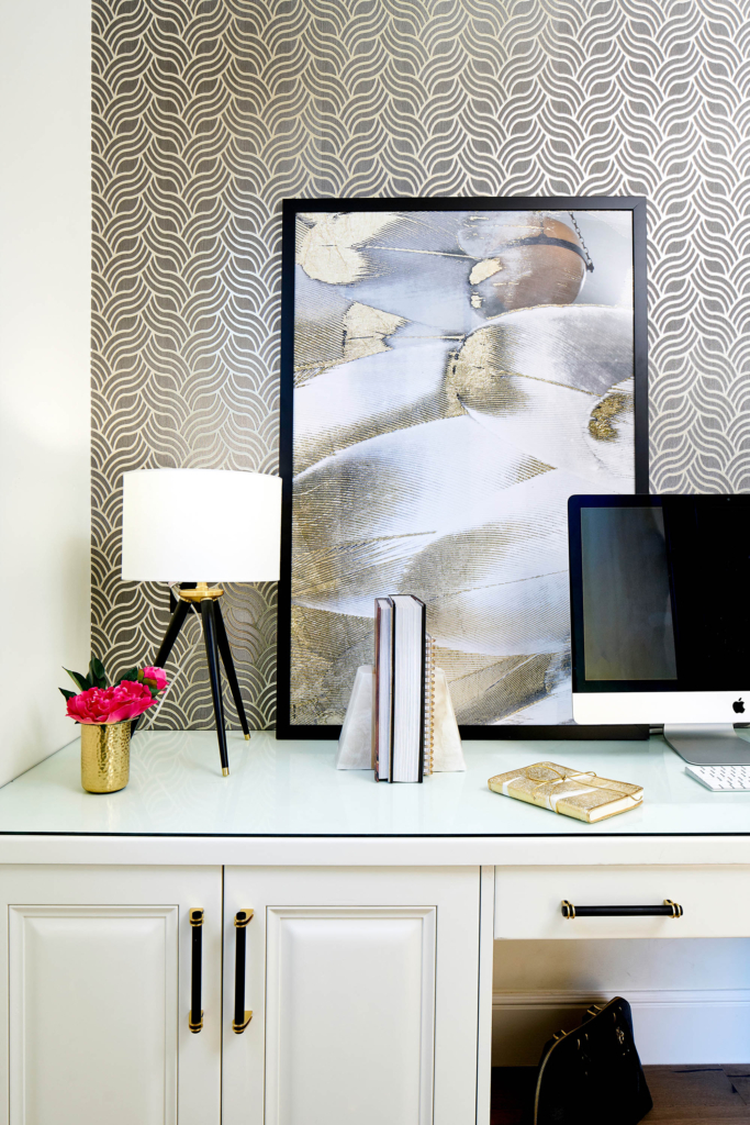 Home office desk cabinets painted in Sherwin Williams "Pure White", with a wallpapered feature wall.