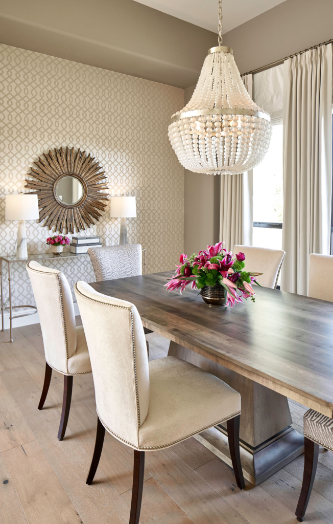 The dining room wallpaper adds subtlety to the neutral color palette.