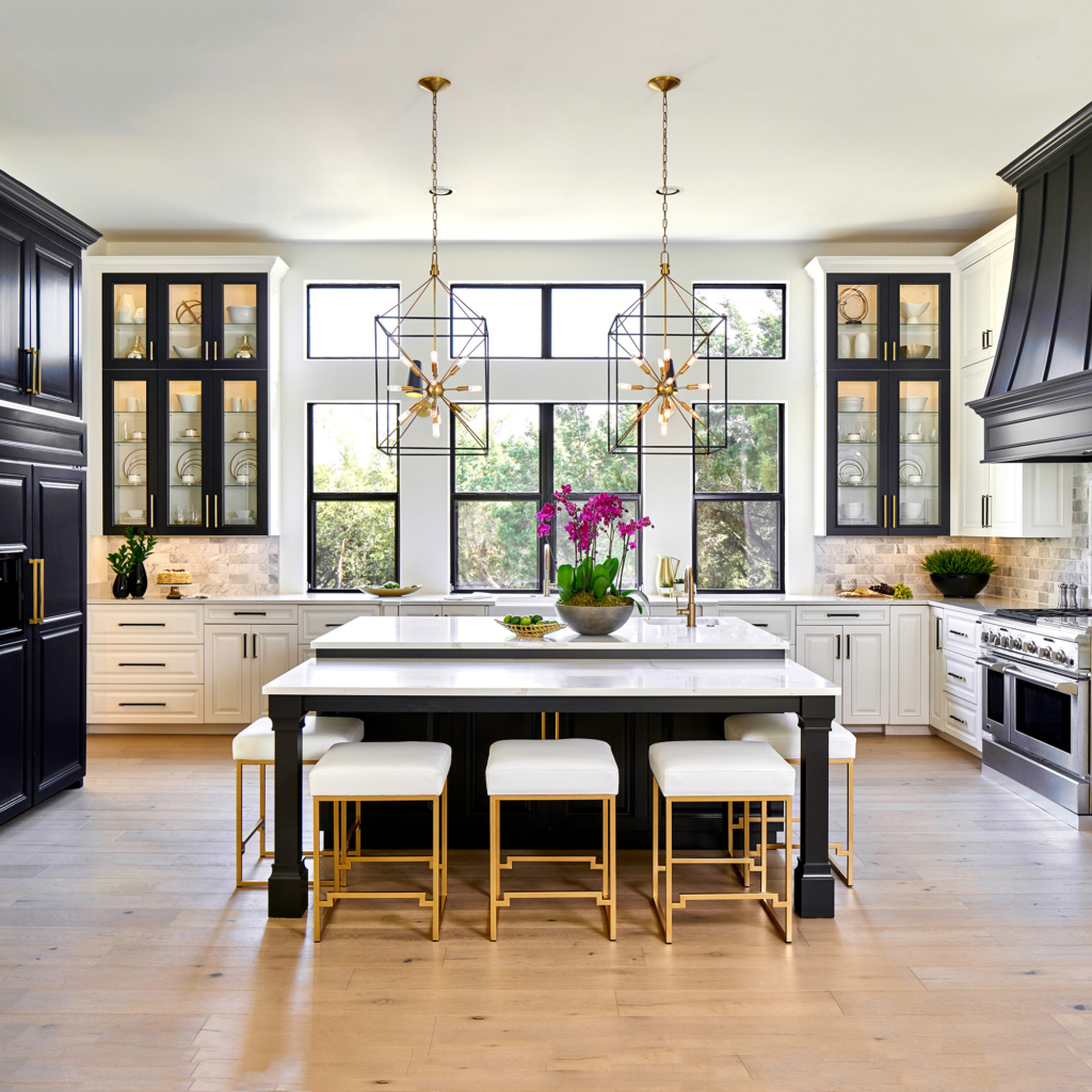 The glass-fronted upper cabinet doors are framed beautifully in black against the surrounding white.