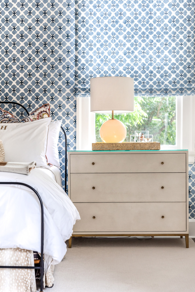 The matching wallpaper-and-fabric installation in the guest is a wonderful custom touch.