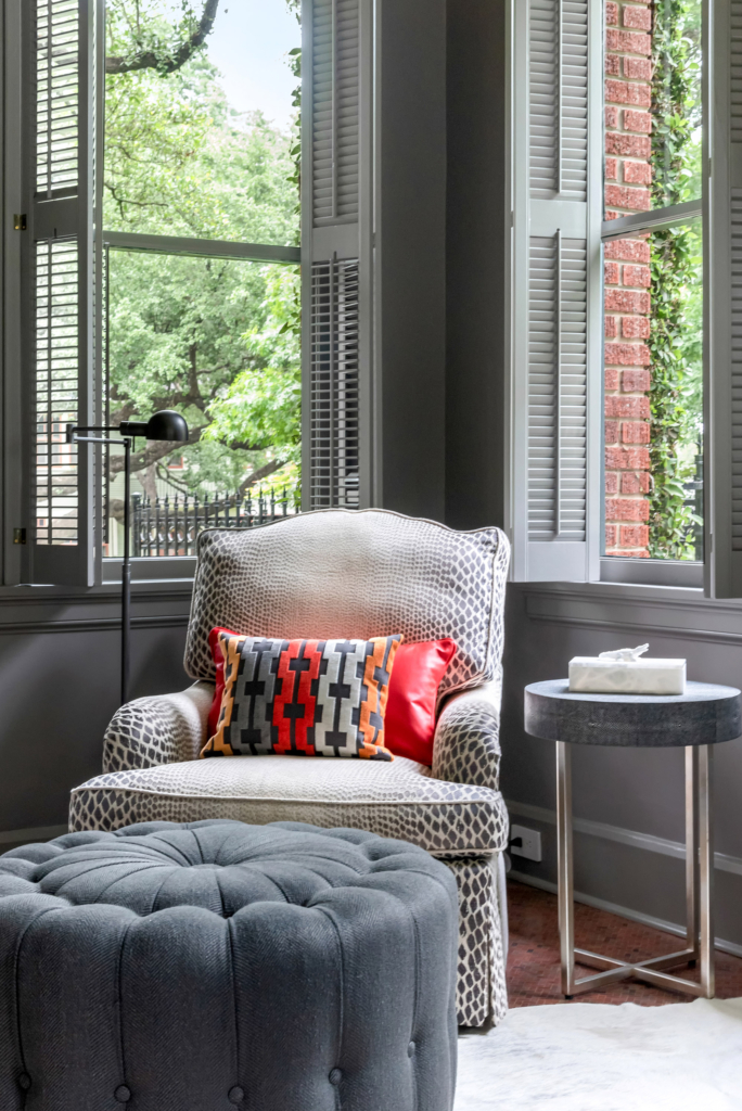 Cozy reading nook color-drenched in grey walls and woodwork.