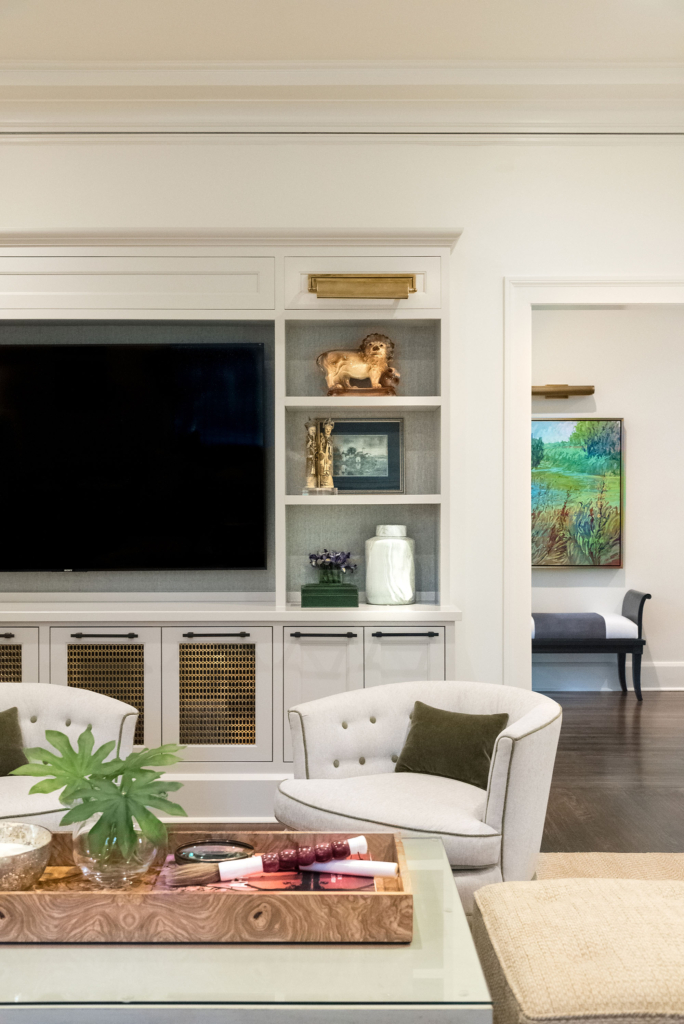 Comfortable seating and built-in bookshelves in the elegant family room.