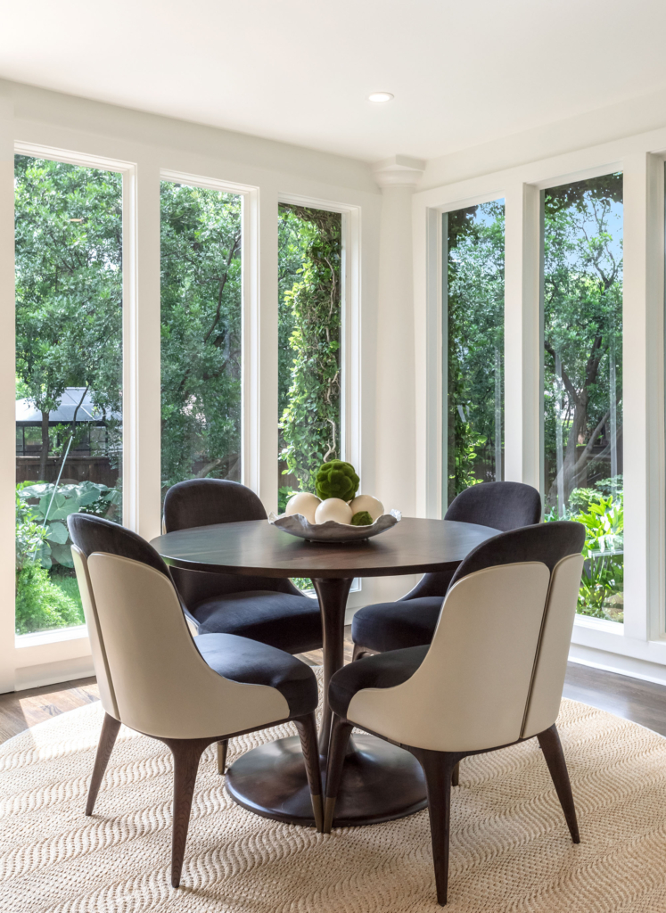 Comfortable contemporary dining in the breakfast area, surrounded by nature.