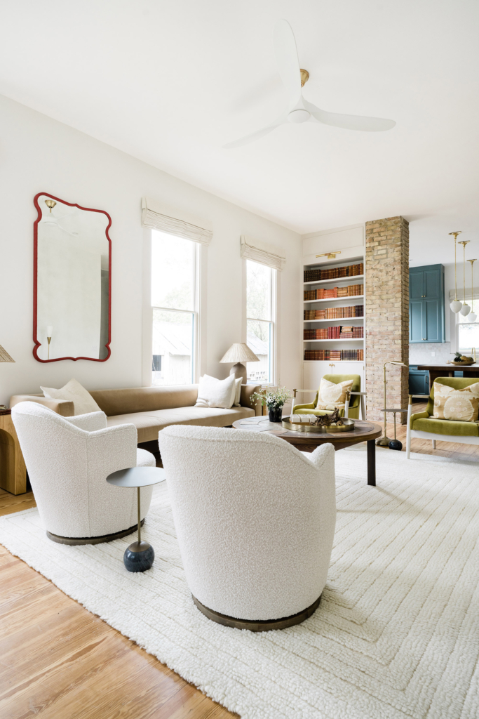 Living room in a beautifully restored Victorian bungalow, with unique features like the brick around the built-ins.