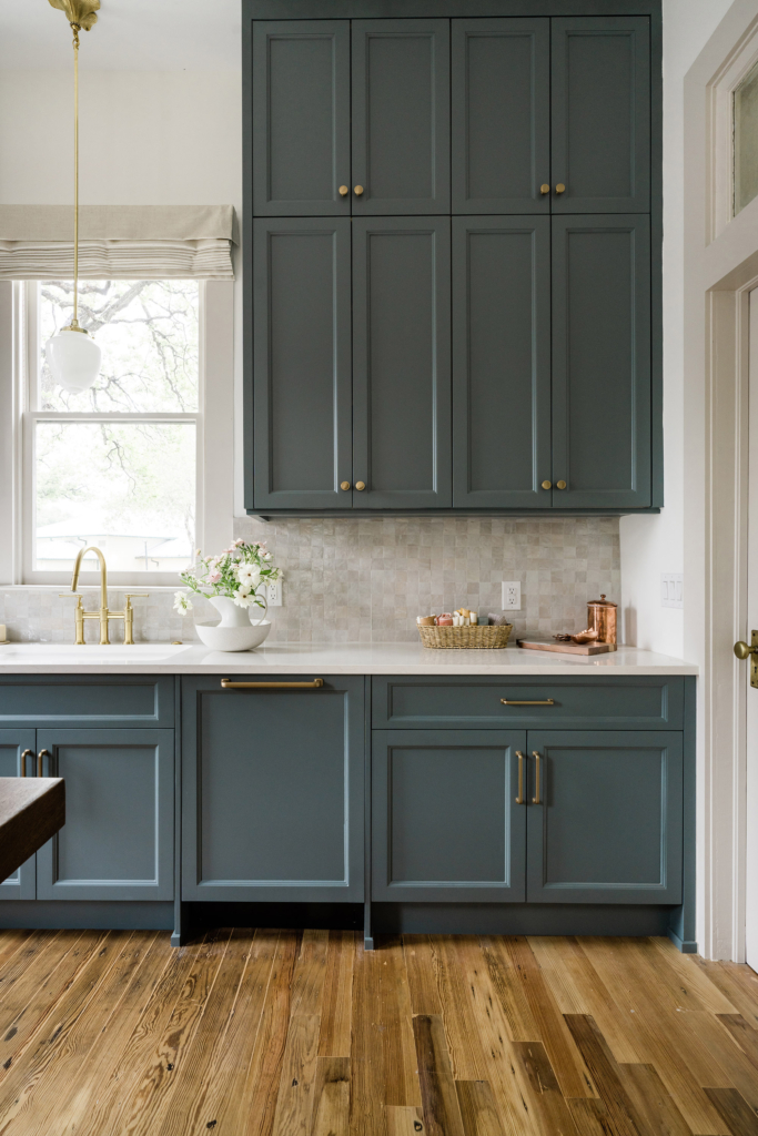 The shaker cabinets in a deep, sophisticated blue give this kitchen a fresh yet timeless look.