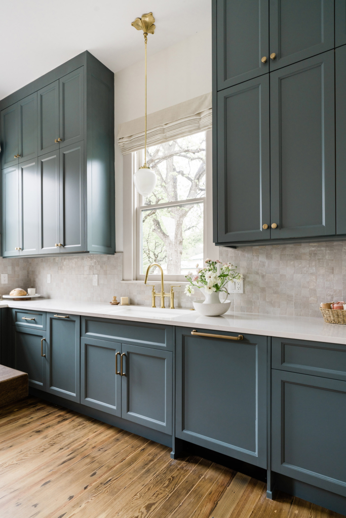 Love this kitchen's striking blue cabinets against walls painted in Farrow & Ball "All White".