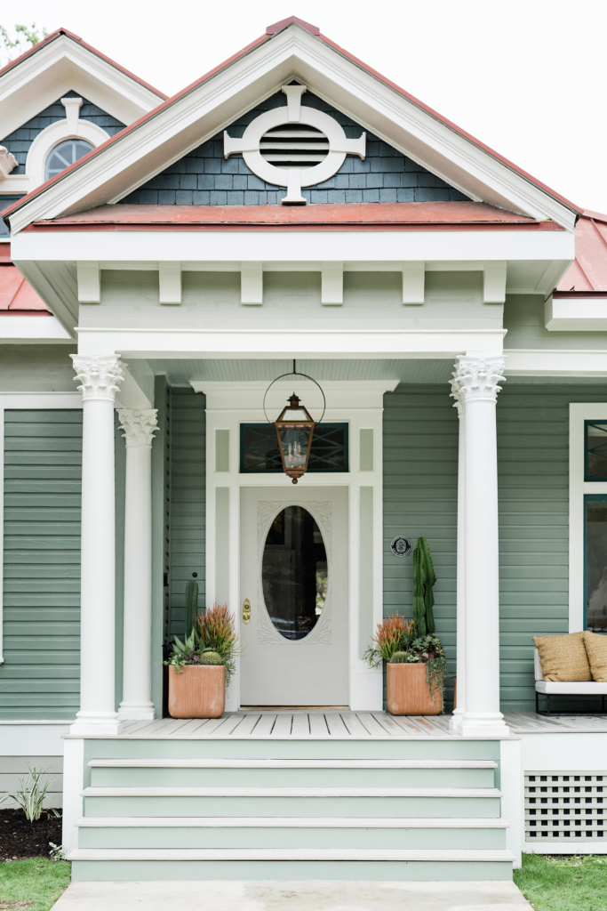 The home looks great in Farrow & Ball’s “Card Room Green”, with "Pointing" on the trim, "French Gray" on the front door, and SW "Intellectual Gray" on the porch floor and steps.
