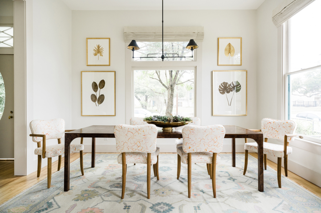 Beautifully restored dining room in this historic home, with walls painted in Farrow & Ball’s “All White”.