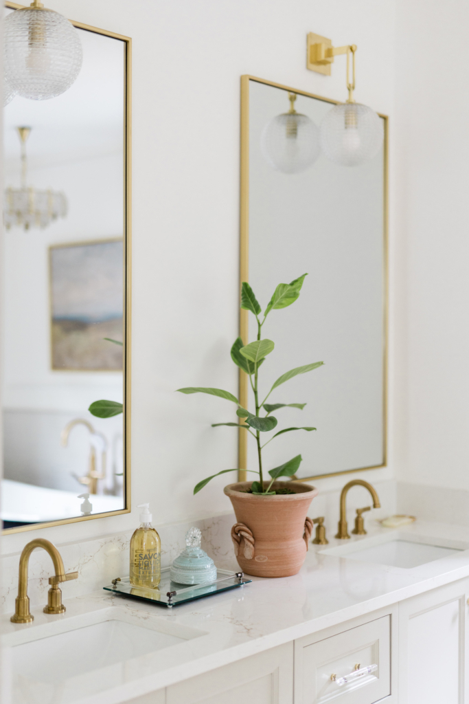 Close-up of the vanity in this beautifully updated primary bath. Walls painted in Farrow & Ball’s “All White”.