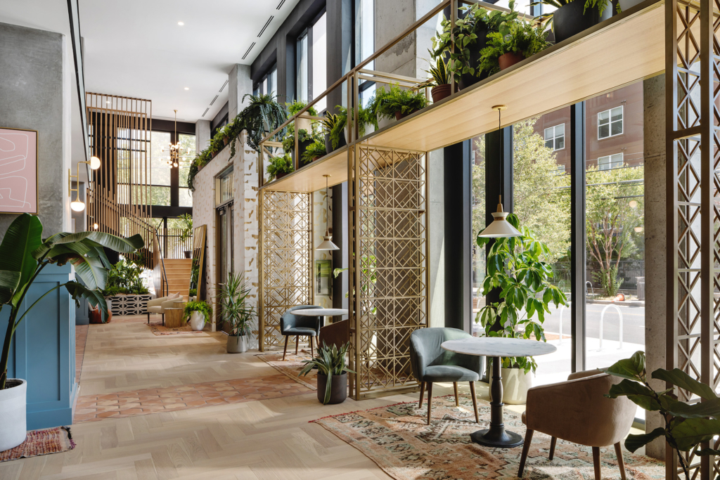 We applied a concrete-look plaster finish in the lobby, which is a virtual kaleidoscope of modern, sophisticated details.