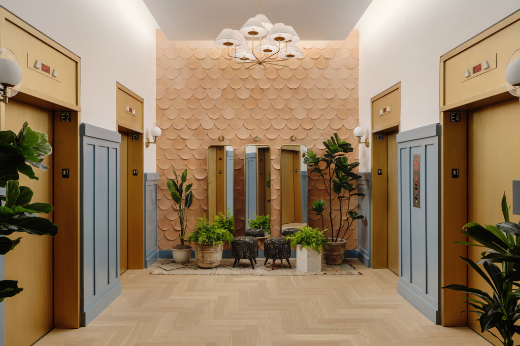 The elevator lobby's elegant scallop-patterned leather tile by AVO adds texture and luxury to what would otherwise be a utilitarian area.