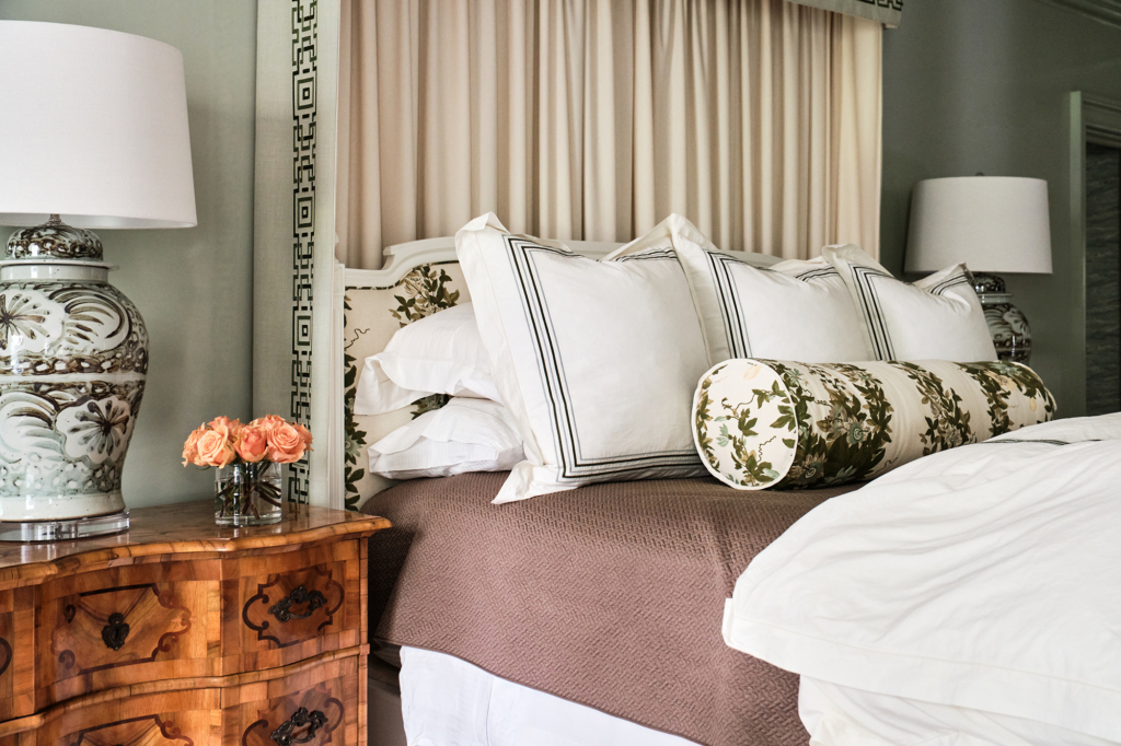 Bedding detail in primary bedroom with walls and woodwork painted in Farrow & Ball "Mizzle" in high gloss