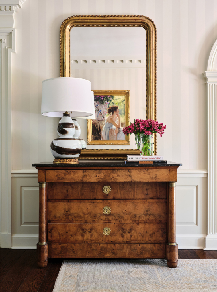 Detail of entry foyer with classic striped wallpaper.