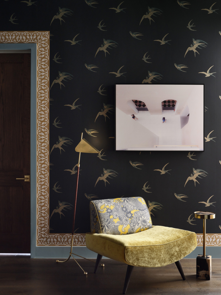 Doorway framed with Sanderson's "Swallows" wallpaper and William Morris' "St Johns" wallpaper border, designed by Rhydima Brar.