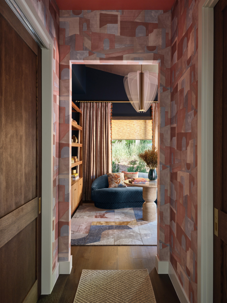 Hallway featuring Phillip Jeffries "Villa Vibes" wallpaper at the House Beautiful Whole Home 2025 in Austin, designed by Amber Guyton. A sophisticated passage with texture, pattern, and designer flair.